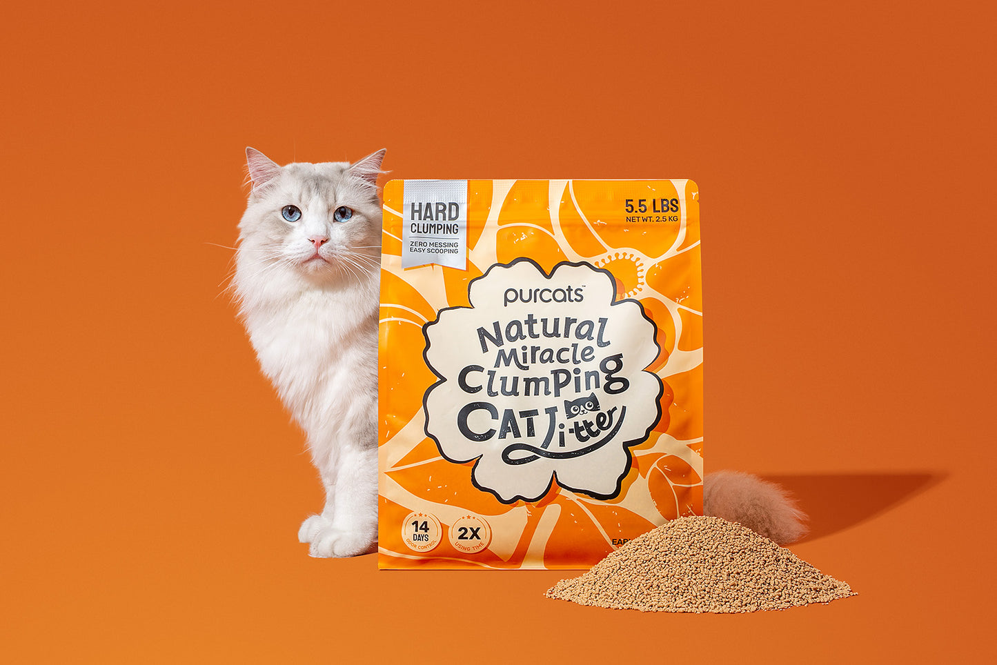 White cat next to Purcats Natural Miracle Clumping Cat Litter bag with Earl Grey scent